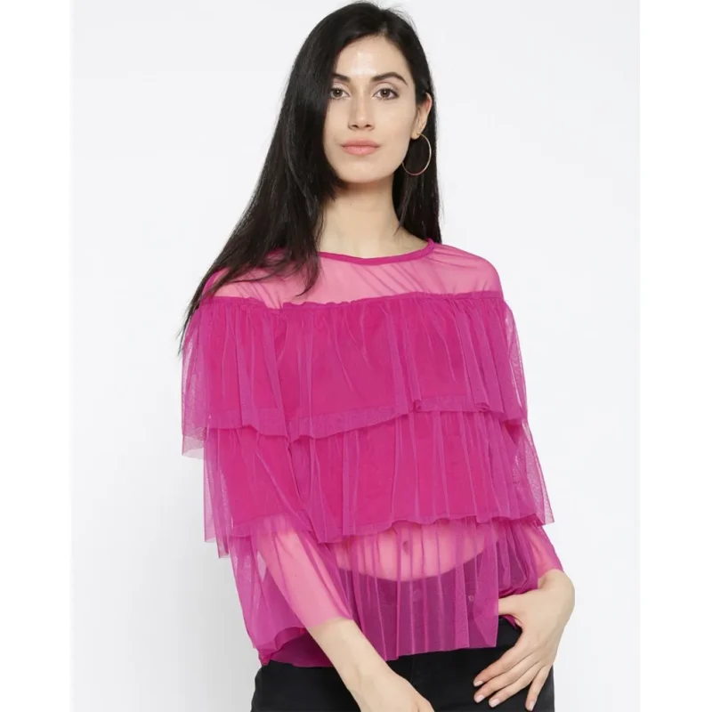 A woman wearing a net sheer top with jeans and heels. Buy now online in Pakistan